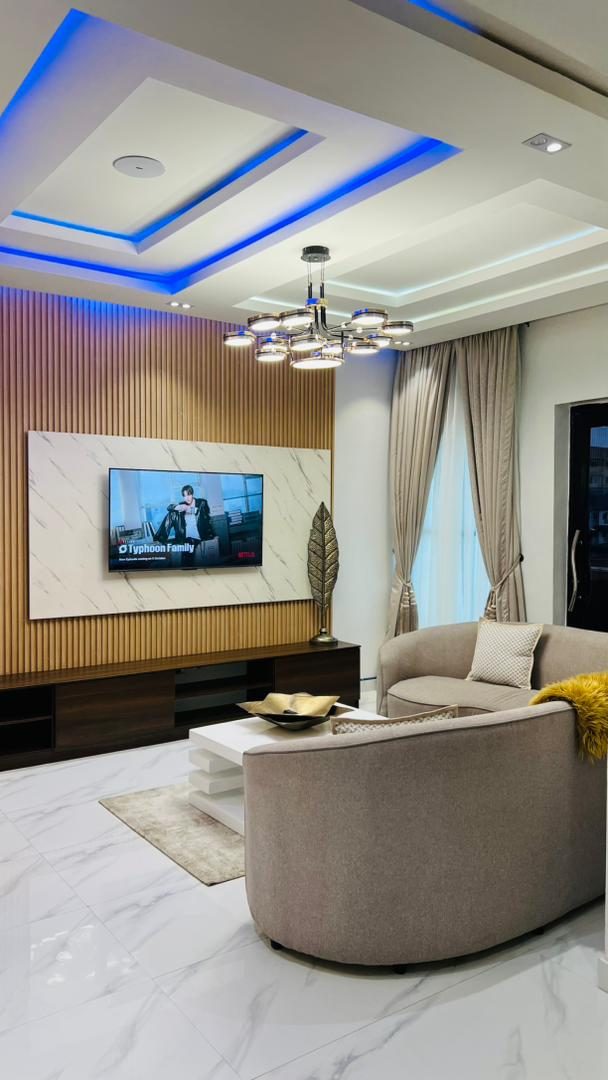 Smart TV and lounge, Apartment Charlie, Nimbus Nook Ikeja GRA